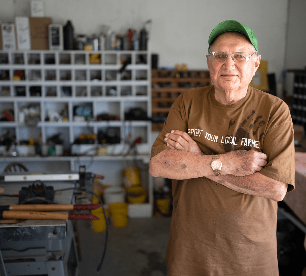 man standing in his hobby shop with arms folded