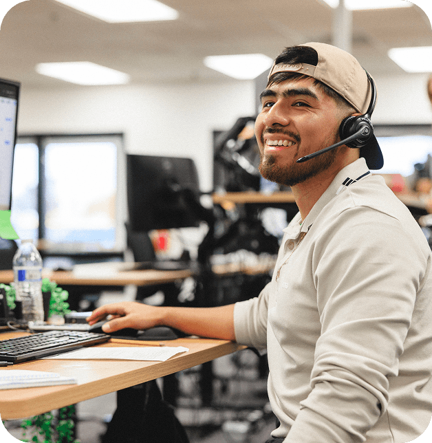 Person at desk with headset on working