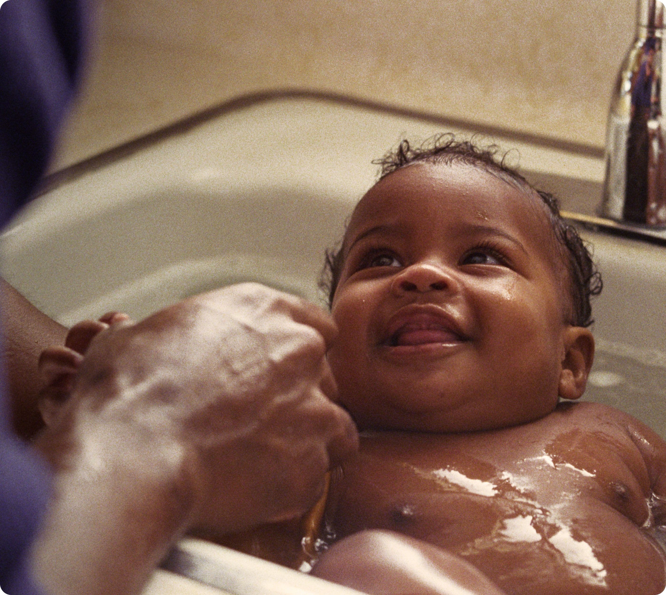 Baby in bath smiling