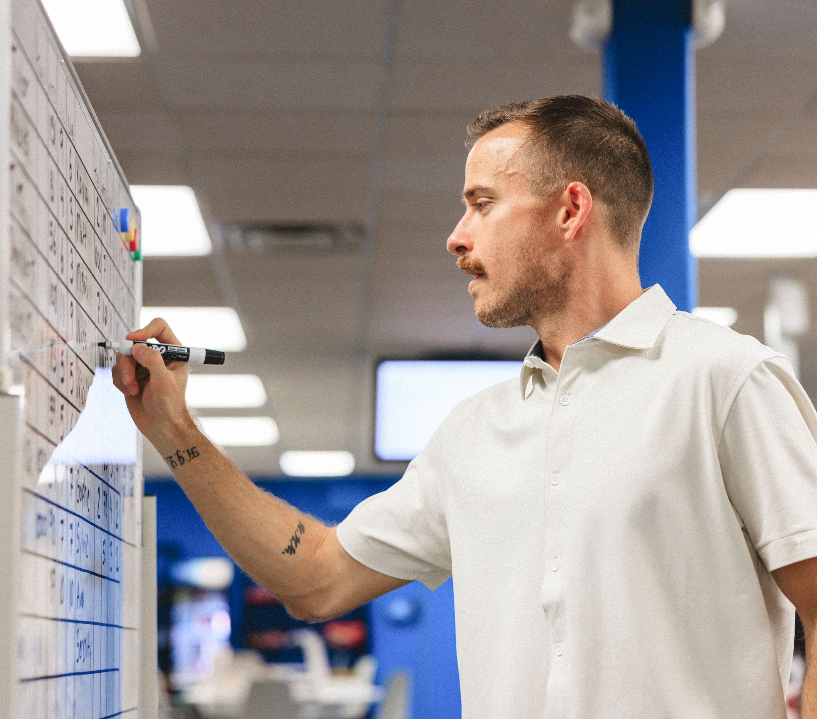 Team member drawing on whiteboard